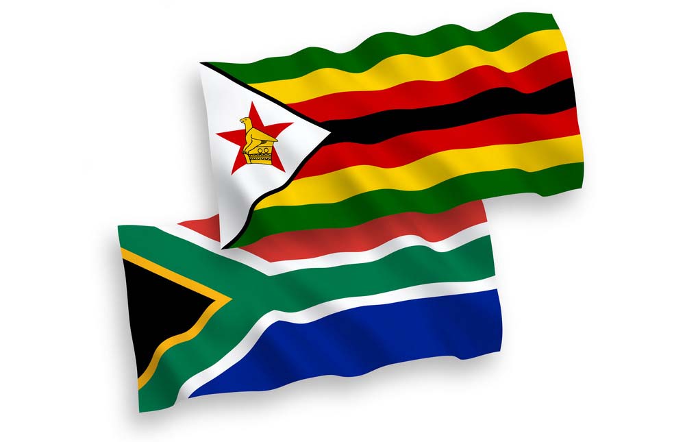 Flags of Zimbabwe and Republic of South Africa on a white background National vector fabric wave flags of Zimbabwe and Republic of South Africa isolated on white background. 1 to 2 proportion.